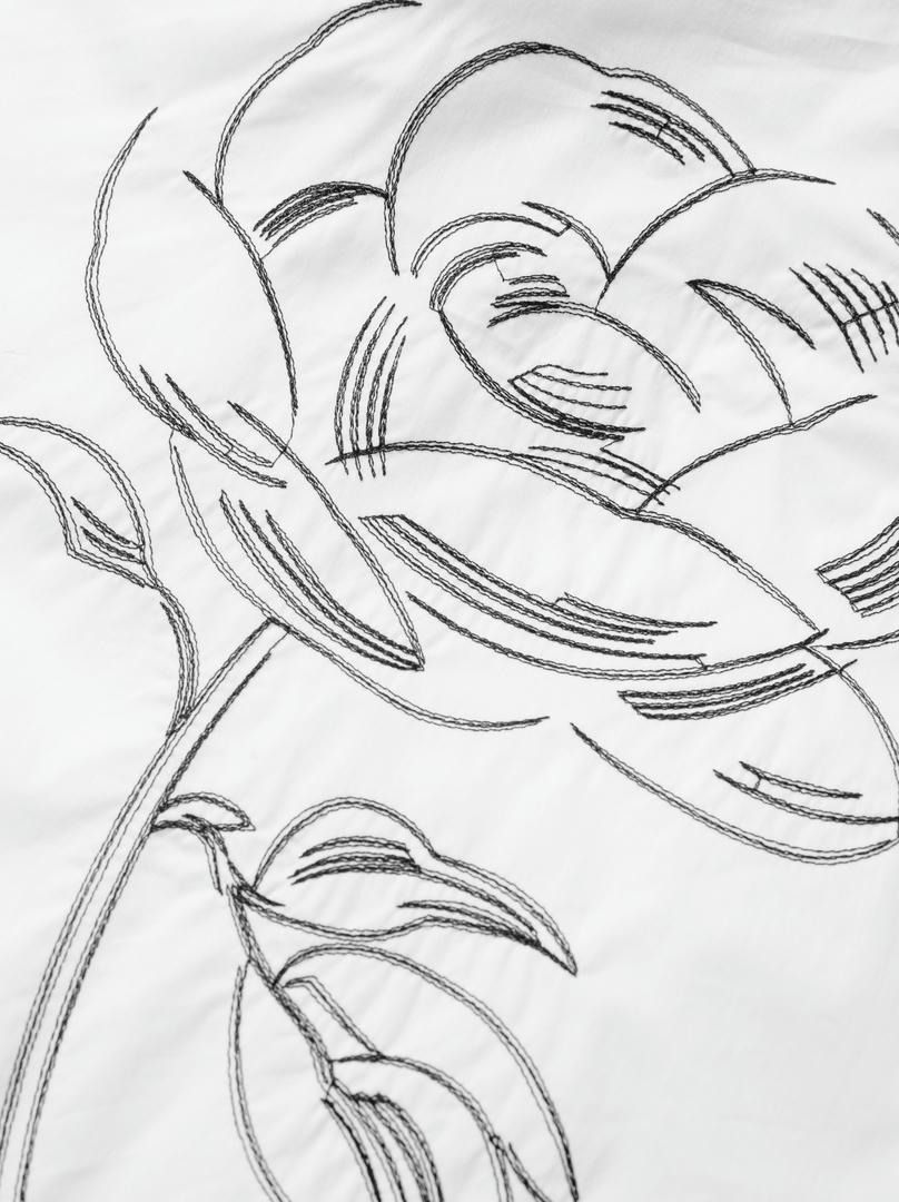 قميص  برسمة ورد